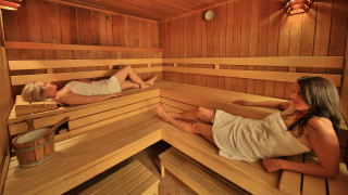 Women relaxing sauna bucket water - viennese actionism free wallpaper