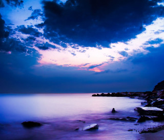 Sunset ocean boat long exposure - a cloudy sky above free wallpaper