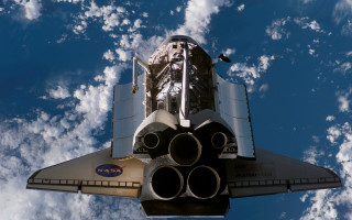 Space shuttle flying clouds blue - free space wallpaper