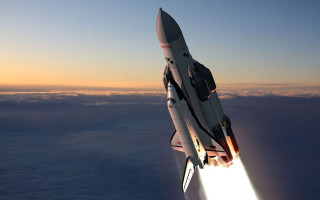 Space shuttle flying bright light - a space shuttle free wallpaper