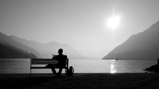 Person bench lake mountains sunshine - shining free wallpaper