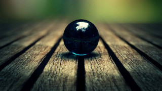 Black ball wooden table green - a green background and a blurry background free wallpaper