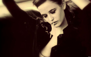 Woman hands head cigarette mouth - leaning against a wall free wallpaper