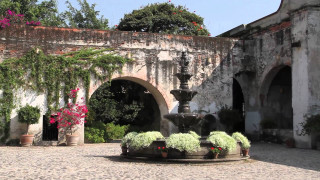 Fountain courtyard potted plants flowers - a stone wall behind free wallpaper for desktop