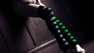 Woman striped stockings green black - her leg in the air free wallpaper