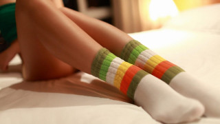 Colorful socks woman bed crossed - alex grey free wallpaper