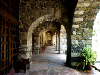Stone building hallway doors bench - a stone building free wallpaper