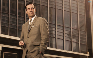 Man suit building tie standing - his hands in his pockets free wallpaper