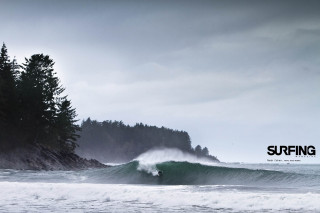 Person riding wave surfboard ocean 2 - a large sign free wallpaper