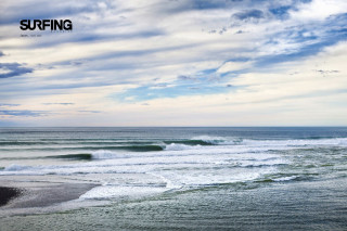 Surfer walking ocean cloudy sky - a surfer free wallpaper for desktop