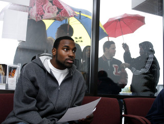 Man sitting couch umbrella paper - bill lewis free wallpaper