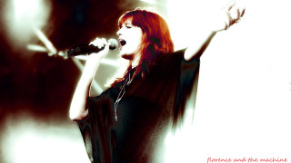 Red haired singer microphone wings - her right arm free wallpaper