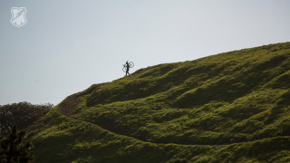Person standing grassy hill kite - ben thompson free wallpaper
