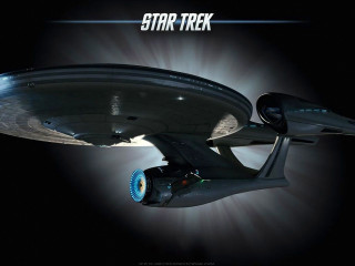 Star trek ship flying light - side and the words free wallpaper