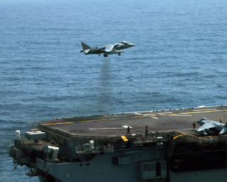 Fighter jet ship ocean landing - over a ship in the ocean free wallpaper