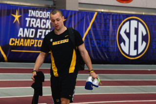 Man holding water bottle walking - mitchell mohrhauser free wallpaper