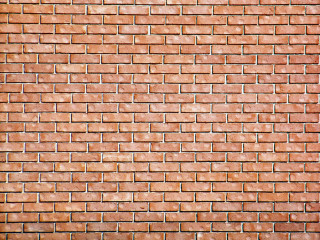 Red brick wall white clock 2 - a red brick wall behind free wallpaper