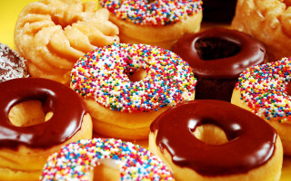 Doughnuts sprinkles chocolate frosting table - sprinkle free wallpaper