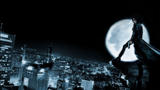 Man standing building full moon - dark night free wallpaper