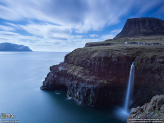 Waterfall cliff ocean blue sky - free landscape wallpaper