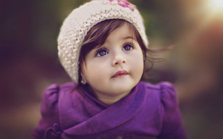 Little girl knitted hat looking - a little girl free wallpaper