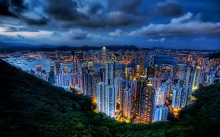 City skyline night cloudy mountain - tall building free wallpaper