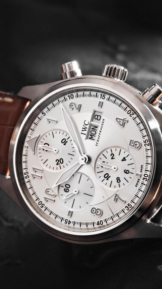 Close up watch black surface - the face free wallpaper for mobile