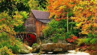 Wooden building river trees rocks - a wooden building free wallpaper