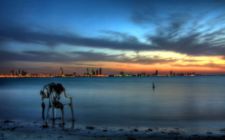 Man beach ocean sunset city - farid mansour free wallpaper