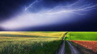 Road field cloudy sky lightning - green grass free wallpaper