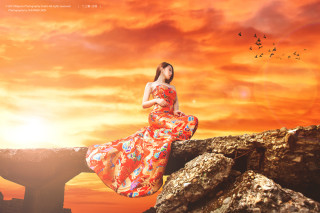 Woman long dress rock sunset - a sunset in the background and birds free wallpaper