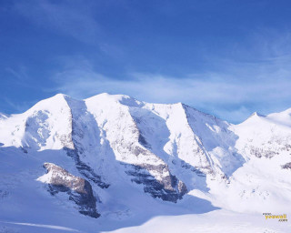 Person skis snow mountain range - a person free wallpaper