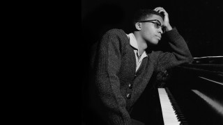 Man leaning piano hands on - a piano free wallpaper