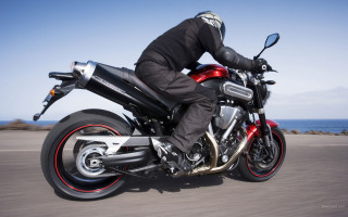 Man motorcycle ocean sunny day - path free wallpaper