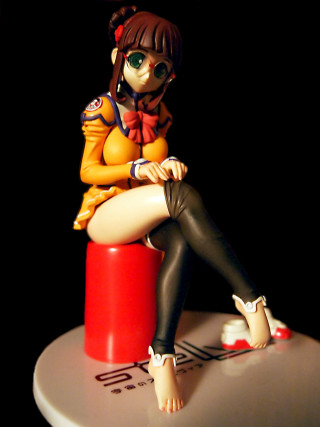 Figurine girl stool sitting crossed - a stool free wallpaper for mobile