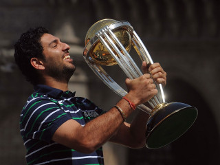 Man holding trophy smiling looking - a trophy free wallpaper