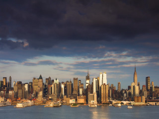 City skyline water cloudy sky 4 - a large body of water in front free wallpaper