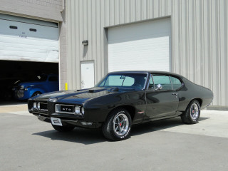 Black muscle car garage blue - a garage door free wallpaper
