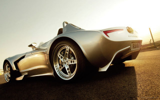 Silver sports car parked side - a silver sports car free wallpaper