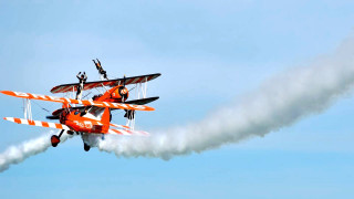 Two planes flying smoke trails - behind them free wallpaper