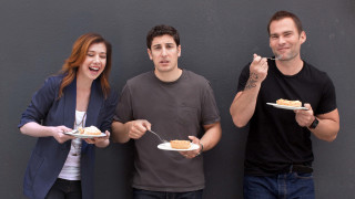 Three people eating food plates - a fork and spoon free wallpaper