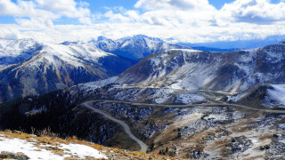 Winding road mountain range snow - edi rama free wallpaper