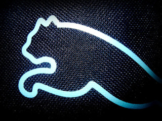 Car emblem closeup door handle - a blue glow free wallpaper