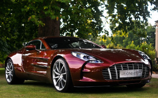 Red sports car grassy area - adam szentpétery free wallpaper