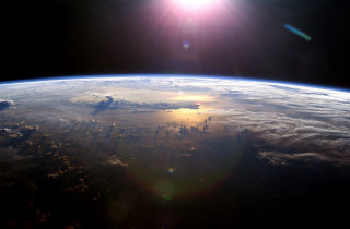 Sun shining earth space view 2 - over the earth free wallpaper