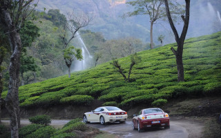 Cars parked road hillside waterfall - two car free wallpaper