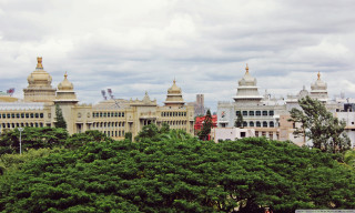 Large building clock tower rooftops - panoramic free wallpaper for desktop
