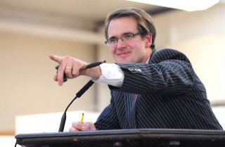 Man pointing podium pen microphone - christopher moeller free wallpaper