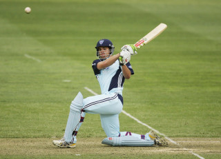 Man blue uniform swinging bat - a bat free wallpaper