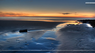 Sunset beach water rocks background - the foreground and a body of water free wallpaper for desktop